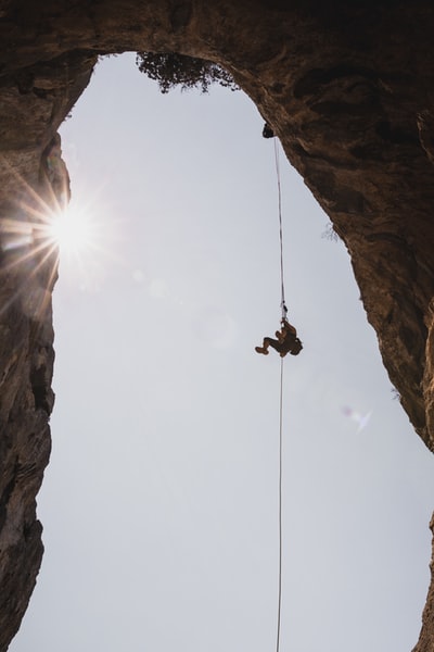 During the day wearing black jacket hung on the rope
